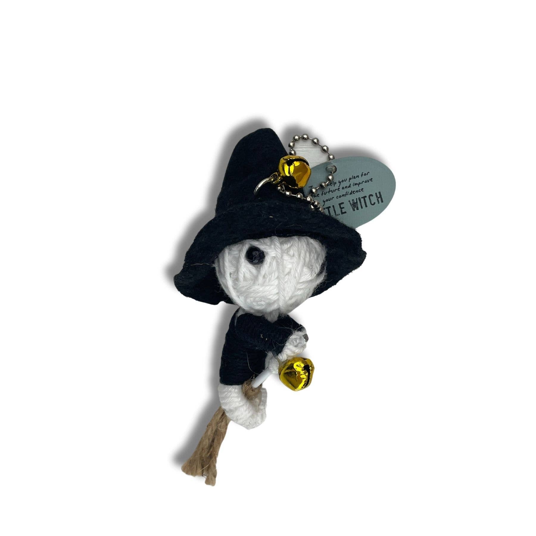 Crocheted white ghost keychain with black hat and yellow bells.