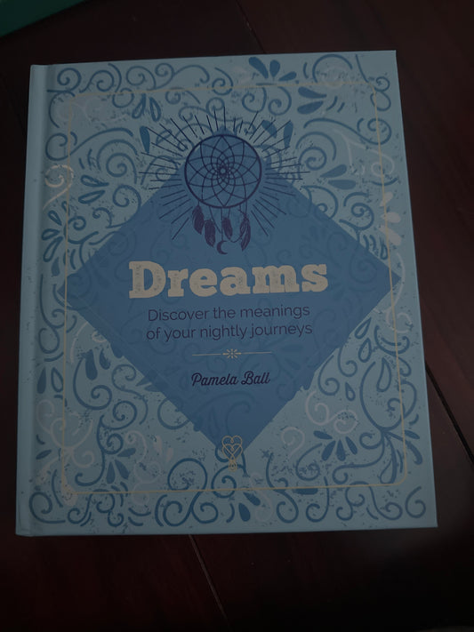 Blue book cover titled Dreams Discover the meanings of your nightly journeys by Pamela Ball.