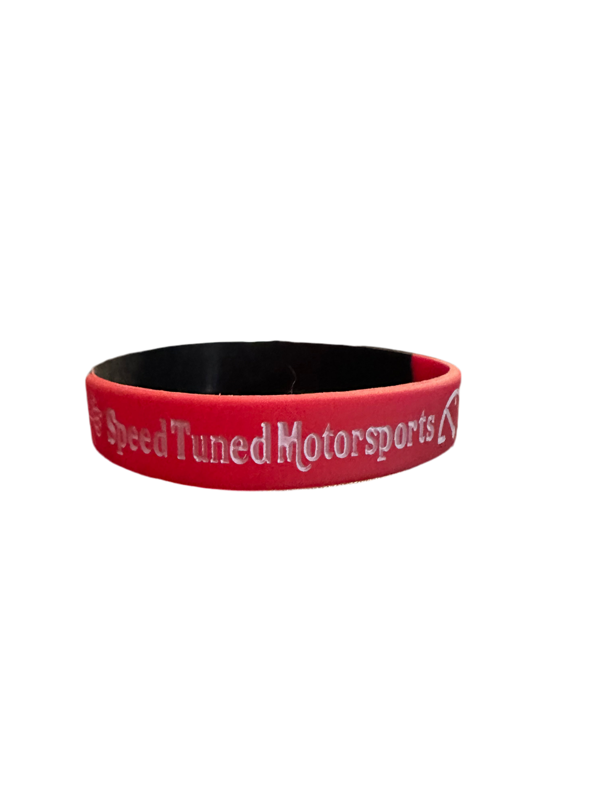 Red wristband with Speed Tuned Motorsports text.