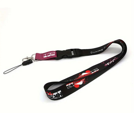 Black HKS lanyard with red accents and logo, white background.