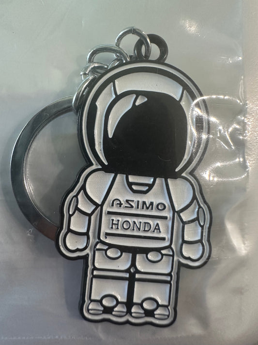 Honda ASIMO robot keychain with metallic design.