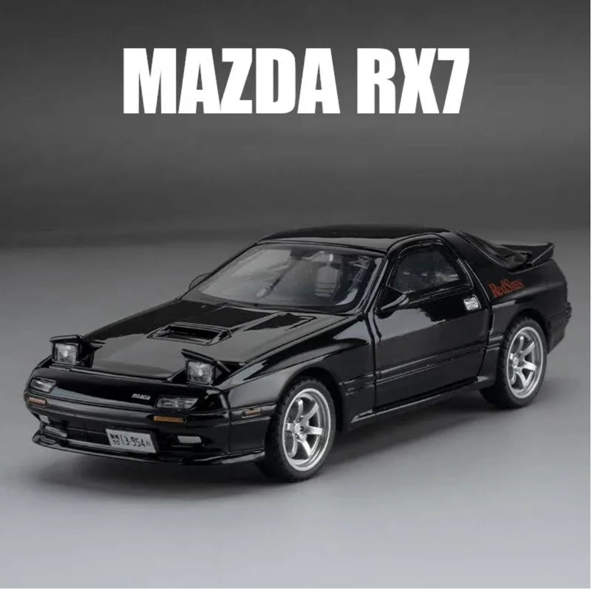 Black Mazda RX7 die-cast model car with RedBull logo.