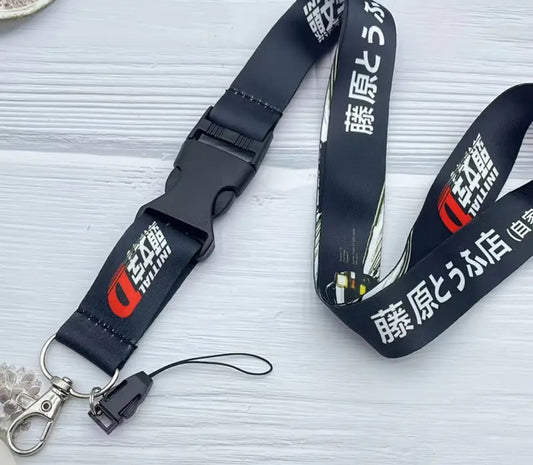 Black lanyard with Initial D and Japanese text design.