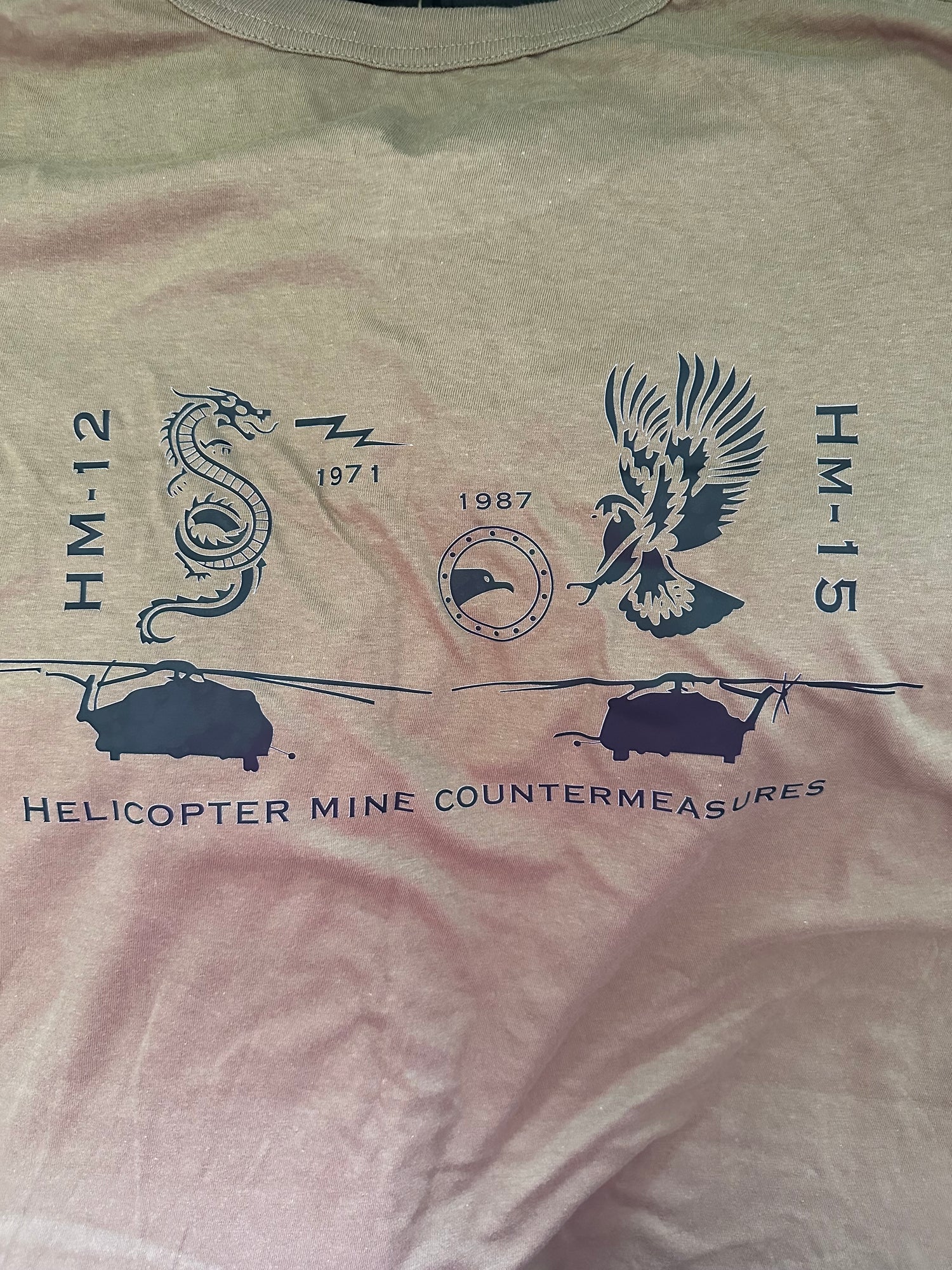 Military t-shirt with HM-12, HM-15, dragon, eagle, helicopters, and Helicopter Mine Countermeasures design.