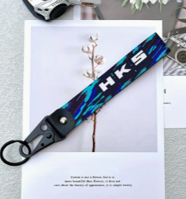 HKS branded lanyard with blue and black design on white background.
