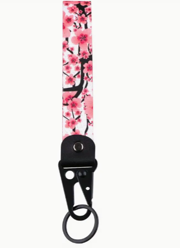 Pink cherry blossom keychain lanyard with black clip and ring.