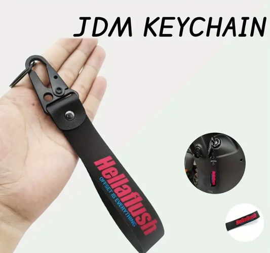 Black leather JDM keychain with Hellaflush text.