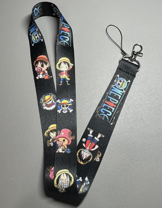 One Piece lanyard with cartoon characters and logo.
