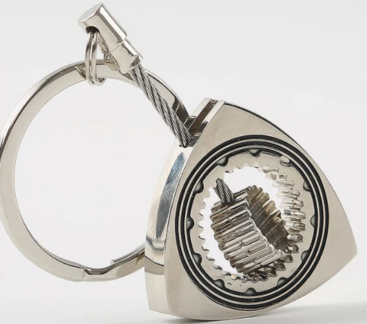 Silver gear design keychain with open mechanism.