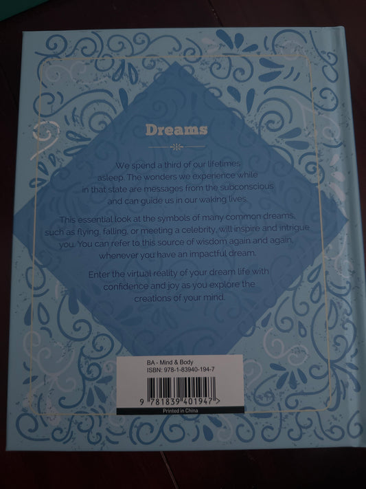 Back cover of Dreams book with dream symbolism explanation and ISBN details.