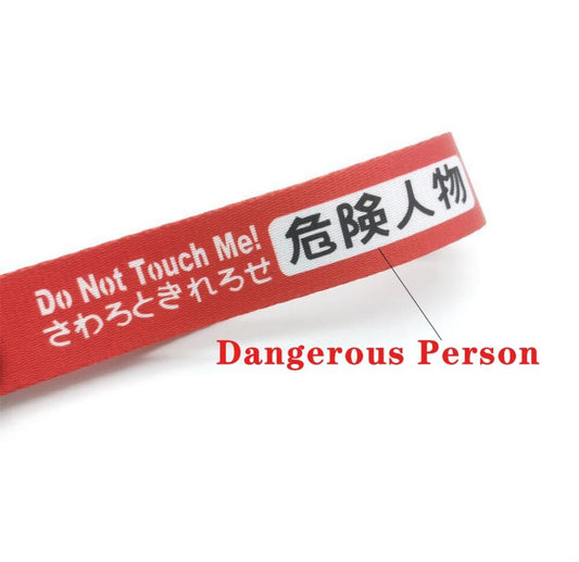 Red wristband with Do Not Touch Me and text.