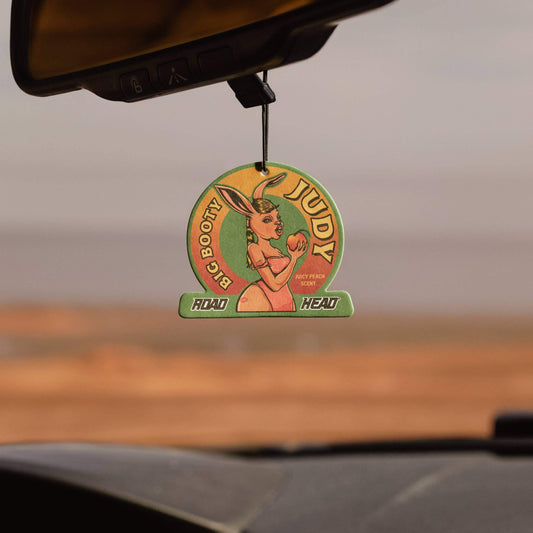 Vintage car air freshener with Judy and rabbit design, peach scent.
