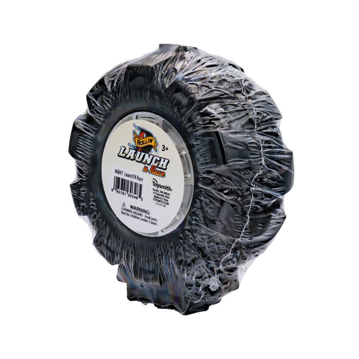 Black plastic-wrapped toy tire with Launch n Race label.