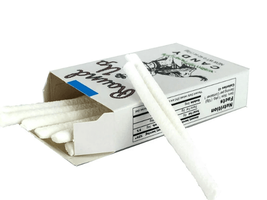 White candy sticks in a cardboard box with Candy text.