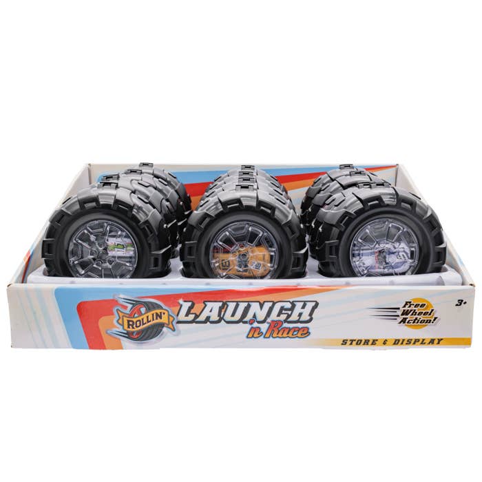 Monster truck wheels in a Launch n Race toy box.