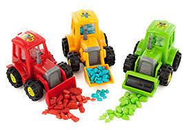 Three colorful toy construction vehicles with rocks and gravel.