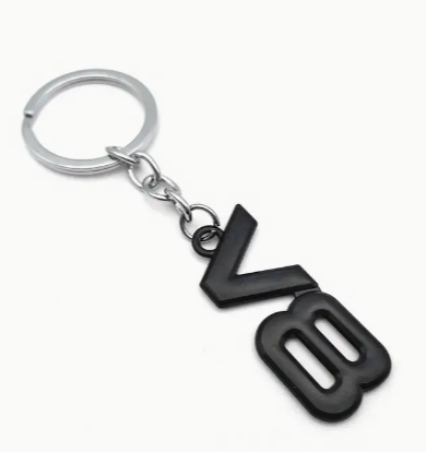Black V8 keychain with silver ring.